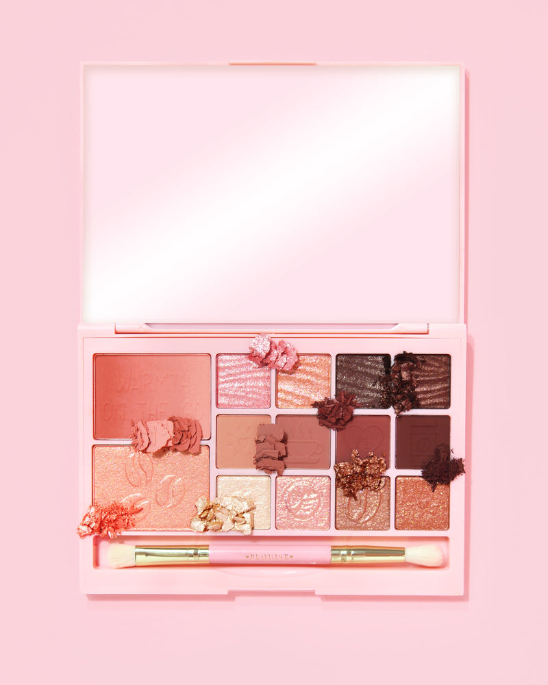 An image of the P. Louise Breakfast Bites All In One Makeup Palette in Hot To Go in a neutral & mauve colour way on a pink background