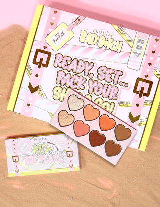 P.Louise All Over The Place Face Palette packaging and product displayed with heart-shaped pan shades in various colours on a bed of sand.