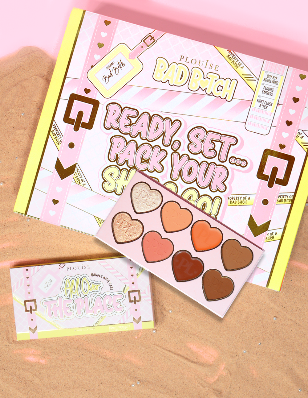 P.Louise All Over The Place Face Palette emballage og produkt udstillet med hjerteformede pande nuancer i forskellige farver på en bund af sand.