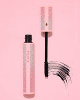Pink glittery P.Louise Cry Baby mascara with black wand on a pink background