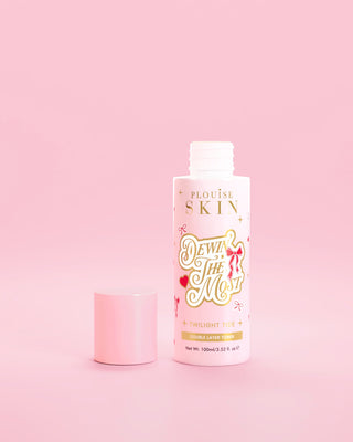 Pink bottle of P.Louise Dewin The MOst Double Layer Toner with red bow designs against a pink background 