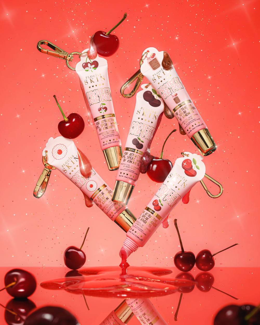 Pink glitter cherry scented protect your pout lip conditioner tubes with cherry design on a red background