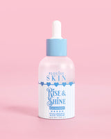 Frasco azul y blanco de suero hialurónico PLouise Rise and Shine en frambuesa azul