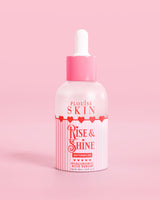 Botella rosa roja y blanca de suero de ácido hialurónico P.Louise Rise & Shine en sandía