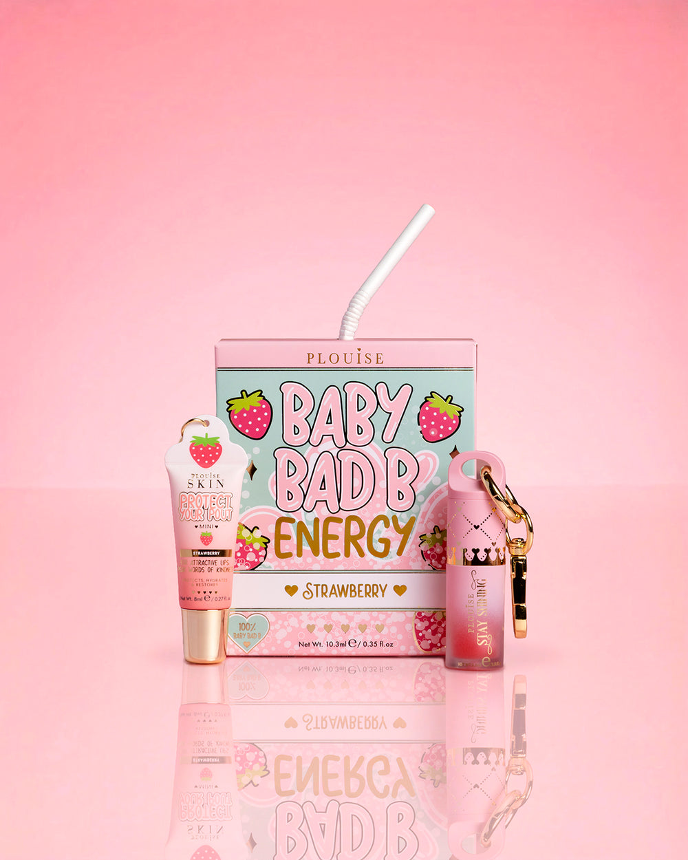 P.Louise Strawberry Baby Bad B Mini Lip Oil & Mini Lip Conditioner sobre fondo rosa