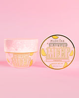 Tub of P. Louise Make It Melt Makeup Cleansing Balm med ananassmag på en lyserød baggrund