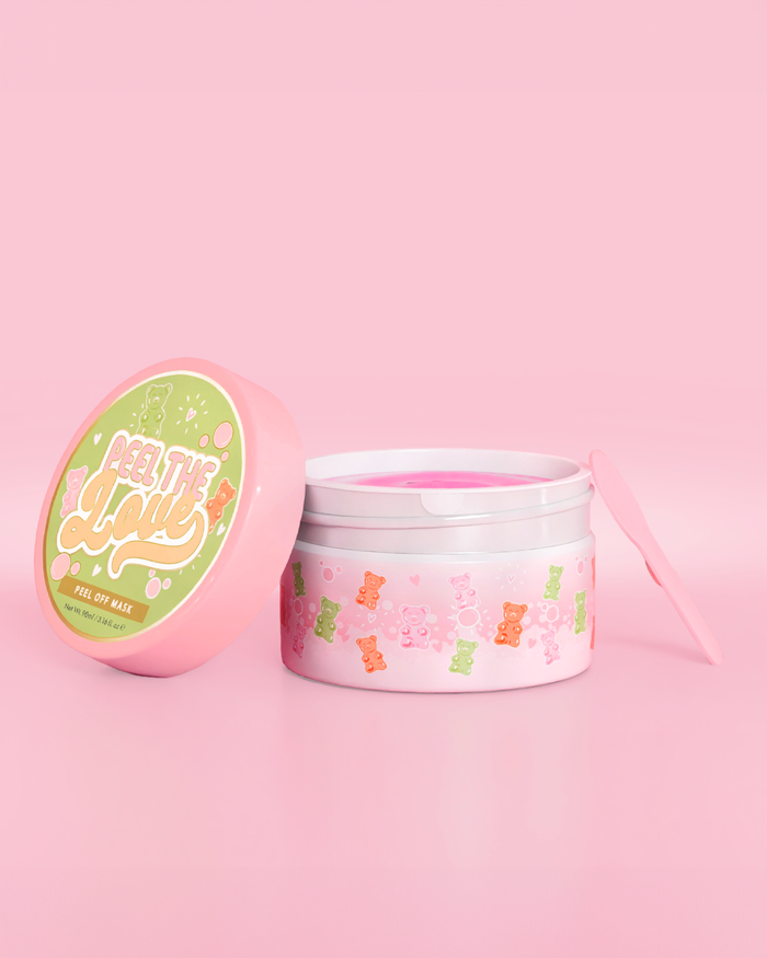 Pink beholder med candy bear design på en pink baggrund